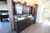 Thumb vanity  contemporary style  clear alder  dark color  recessed panel  open cubbies  medicine cabinet  linen  double sinks  master bath  full overlay