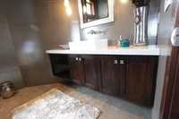 Thumb vanity  contemporary style  western maple  dark color  open bookcase  cubbies  single sink  off center sink  full overlay