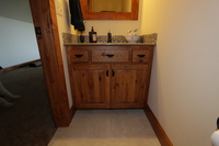 Thumb vanity  rustic style  knotty hickory  medium color  raised panel  single sink  standard overlay  2 