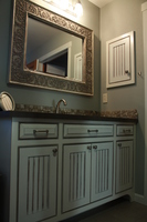 Thumb vanity  traditional style  painted with glaze  wainscot panel  flush mount  medicine cabinet  arched toekick  bevel drawer fronts