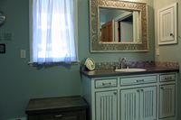 Thumb vanity  traditional style  painted with glaze  wainscot panel  flush mount  medicine cabinet  arched toekick  contrast bench seat