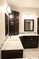 Thumb vanity  traditional style  walnut  dark color  recessed panel  double sink  diagonal  tower topper  diagonal bank of drawers  master bath  standard overlay