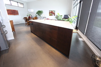 Thumb kitchen  contemporary style  quartersawn walnut  dark color  banded door  angled island  frameless style