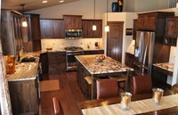Thumb kitchen  shaker style  knotty hickory  dark color  recessed panel  island with legs  posts  staggered height  micro hood  full overlay  2 
