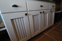 Thumb laundry or utility  traditional style  painted with glaze  wainscot panel doors  full overlay