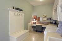 Thumb laundry or utility  traditional style  painted  raised panel doors  lift up bench seat with recessed panel back and front   7 crown  coat hooks  dry rod  desk area  mud room